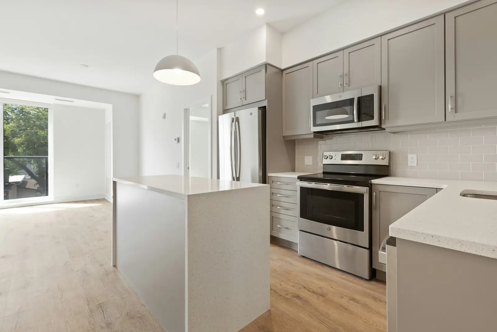 Open kitchen with an island and a built-in oven