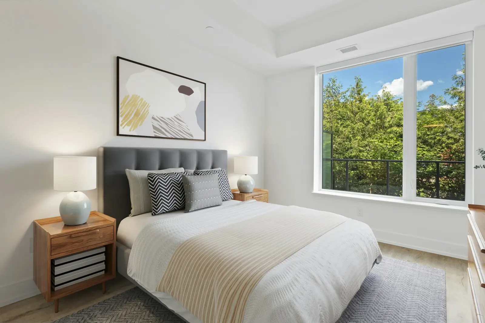 Bedroom with a window looking out on trees