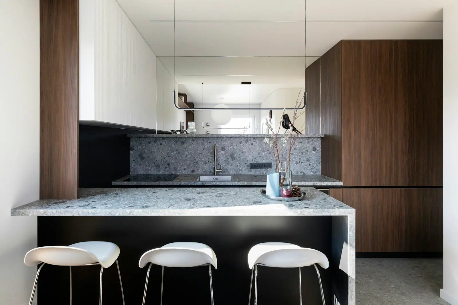 Kitchen with built-in appliances and a breakfast bar